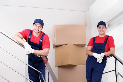 Removal team preparing household items for transport
