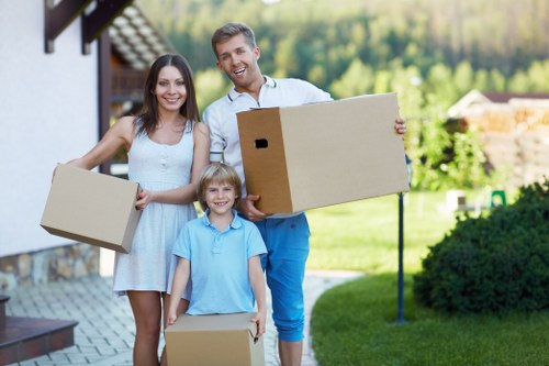 Movers handling boxes and delicate items in central London