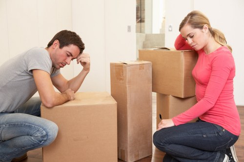 Mover carrying a boxed item with care during a Mayfair relocation