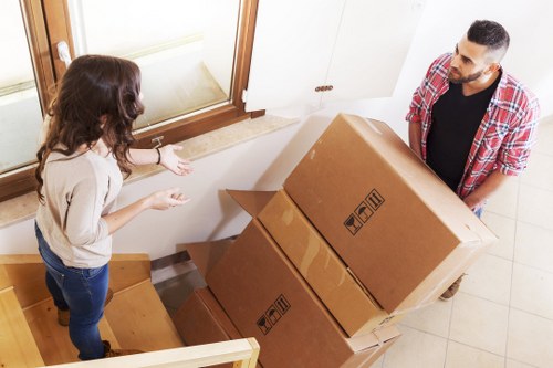Removal crew loading furniture into a vehicle