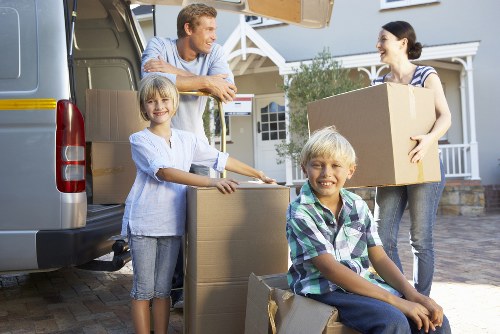 Professional movers transporting household furniture near Mayfair
